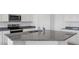 Kitchen island features granite countertops and a stainless steel sink at 1534 E Mason Dr, Casa Grande, AZ 85122