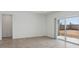 Bright living room features tile flooring and sliding glass doors to the backyard at 1534 E Mason Dr, Casa Grande, AZ 85122