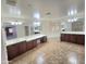 Large bathroom with double vanities, bathtub, and tile flooring at 15656 W Desert Mirage Dr, Surprise, AZ 85379