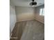 A bedroom has a ceiling fan and lots of natural light at 15656 W Desert Mirage Dr, Surprise, AZ 85379