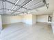 Spacious garage with epoxy flooring and ample storage space at 15656 W Desert Mirage Dr, Surprise, AZ 85379