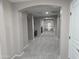 Open hallway leading to a railing overlooking the downstairs at 15656 W Desert Mirage Dr, Surprise, AZ 85379
