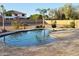 Backyard oasis featuring a private pool surrounded by desert landscaping and a stone patio at 15656 W Desert Mirage Dr, Surprise, AZ 85379