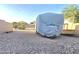 Spacious RV parking area with gravel and privacy fence at 15656 W Desert Mirage Dr, Surprise, AZ 85379