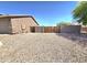 Spacious side yard with rock landscaping and gated entrance perfect for extra storage or outdoor activities at 15656 W Desert Mirage Dr, Surprise, AZ 85379