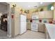 Cozy kitchen with modern appliances, light-colored cabinets, and a tile backsplash at 15790 W Arrowhead Dr, Surprise, AZ 85374