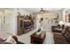 Inviting living room features a decorative entertainment center, hardwood floors and natural lighting at 15790 W Arrowhead Dr, Surprise, AZ 85374