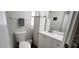 Bright bathroom featuring new vanity, framed mirror, new sink and faucet, and modern commode at 17200 W Bell Rd # 1622, Surprise, AZ 85374