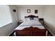 Cozy bedroom showcasing a plush bed with patterned bedding and a side table at 17200 W Bell Rd # 1622, Surprise, AZ 85374