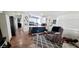 Comfortable living area blending into the kitchen with hardwood floors and cozy armchair at 17200 W Bell Rd # 1622, Surprise, AZ 85374