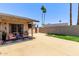 Spacious backyard featuring a patio area, palm trees, and a privacy fence, ideal for outdoor enjoyment at 1809 S Heritage --, Mesa, AZ 85210