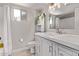 Well-lit bathroom with a modern vanity, sleek fixtures, and a shower-tub combo, creating a relaxing space at 1809 S Heritage --, Mesa, AZ 85210