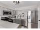 Updated kitchen featuring stainless steel appliances, gray cabinets, subway tile backsplash, and stylish fixtures at 1809 S Heritage --, Mesa, AZ 85210