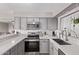 Bright kitchen showcasing sleek countertops, stainless steel appliances, and a modern subway tile backsplash at 1809 S Heritage --, Mesa, AZ 85210