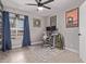 Bright office space features blue curtains, contemporary desk and chair, complemented by decorative artwork at 1809 S Heritage --, Mesa, AZ 85210