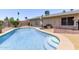 Enjoy a refreshing swim in this pool, featuring steps and a seating area, perfect for hot summer days at 1809 S Heritage --, Mesa, AZ 85210