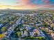 Expansive aerial view of the neighborhood, featuring neat rows of houses and vibrant greenery at sunset at 1913 S River Dr, Tempe, AZ 85281