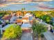 Aerial view showcases a well-maintained neighborhood with tiled roofs and mature trees at 1913 S River Dr, Tempe, AZ 85281
