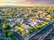 This aerial view shows the real estate, including roads, a pool, landscaping and nearby dwellings at 1913 S River Dr, Tempe, AZ 85281