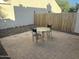 Cozy backyard patio with brick pavers and a small outdoor table set at 1913 S River Dr, Tempe, AZ 85281