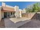 Private backyard with a paved patio, wooden fence, and outdoor seating area for relaxing or entertaining at 1913 S River Dr, Tempe, AZ 85281