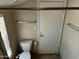 Bathroom featuring a toilet, and towel rack at 1913 S River Dr, Tempe, AZ 85281