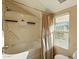 Bathroom with tub/shower combo and window at 1913 S River Dr, Tempe, AZ 85281