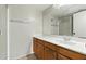 Bathroom vanity and sink with mirror and walk-in shower at 1913 S River Dr, Tempe, AZ 85281