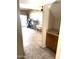 View from doorway into large bonus room featuring neutral colors, tile floor and a sink with cabinets at 1913 S River Dr, Tempe, AZ 85281