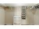 Walk-in closet with built-in shelving and drawers at 1913 S River Dr, Tempe, AZ 85281