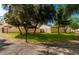 Expansive community grounds with mature trees, lush lawns, and well-maintained walking paths at 1913 S River Dr, Tempe, AZ 85281