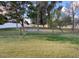 Manicured community lawn with scattered trees and walking paths under a bright sky at 1913 S River Dr, Tempe, AZ 85281