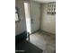 Welcoming entryway featuring tile floors, coat rack and natural light from the front door at 1913 S River Dr, Tempe, AZ 85281
