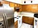 This kitchen boasts stainless steel appliances, light countertops, and ample cabinet space for a functional cooking experience at 1913 S River Dr, Tempe, AZ 85281