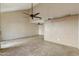 Bright living room featuring tile floors and a ceiling fan at 1913 S River Dr, Tempe, AZ 85281