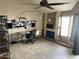 Bright living room featuring tile floors, fireplace and ceiling fan at 1913 S River Dr, Tempe, AZ 85281