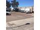 View of a parking area containing vehicles, trailers and campers, possibly for storage or staging purposes at 1913 S River Dr, Tempe, AZ 85281
