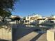 View of community pool with neighboring condo buildings and spa at 1913 S River Dr, Tempe, AZ 85281