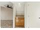 Living Room wet bar featuring tile floors, oak cabinets, and a sink at 1913 S River Dr, Tempe, AZ 85281