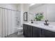 Bathroom featuring double sinks, a shower-tub combination, and patterned tile floors at 1956 W Kinfield Trl, Phoenix, AZ 85085