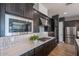 Modern kitchen featuring stainless steel appliances, designer backsplash, and a functional layout at 1956 W Kinfield Trl, Phoenix, AZ 85085