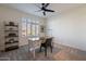 Bright office with large windows, desk space, and a contemporary ceiling fan at 1956 W Kinfield Trl, Phoenix, AZ 85085