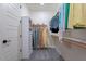 Walk-in closet with shelving and hanging space for organized storage at 1956 W Kinfield Trl, Phoenix, AZ 85085