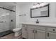 Updated bathroom featuring a modern vanity, framed mirror, and glass enclosed shower at 20100 N 78Th Pl # 2114, Scottsdale, AZ 85255