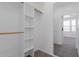 Walk-in closet with built in shelving and full length mirror at 20100 N 78Th Pl # 2114, Scottsdale, AZ 85255