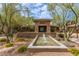 Beautiful community clubhouse with fountain, showcasing manicured landscaping and inviting entrance at 20100 N 78Th Pl # 2114, Scottsdale, AZ 85255