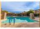 Inviting community pool with crystal-clear water, lounge chairs, and well-maintained landscaping for relaxation at 20100 N 78Th Pl # 2114, Scottsdale, AZ 85255