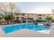 Sparkling community pool surrounded by well-maintained landscaping and comfortable lounge chairs for relaxing at 20100 N 78Th Pl # 2114, Scottsdale, AZ 85255