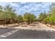 Gated entrance to community with well-maintained landscaping, ensuring privacy and security for residents at 20100 N 78Th Pl # 2114, Scottsdale, AZ 85255