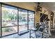 Gym featuring large windows overlooking pool and lounge area, creating an open and inviting workout space at 20100 N 78Th Pl # 2114, Scottsdale, AZ 85255